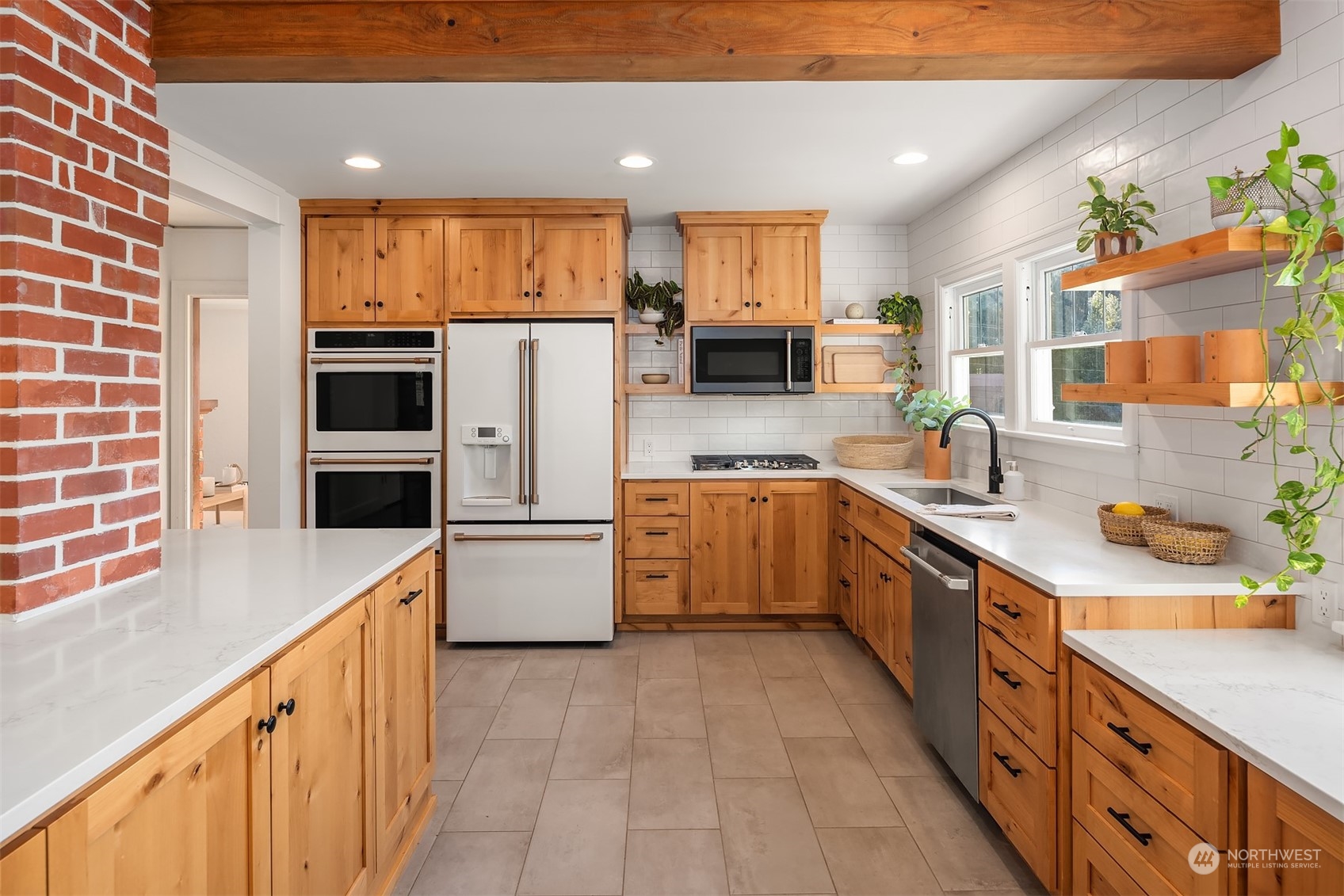7715 Robe Menzel Road Granite Falls, WA 98252 - Photo 12 of 38 a kitchen with a sink a counter top space stainless steel appliances and a window
