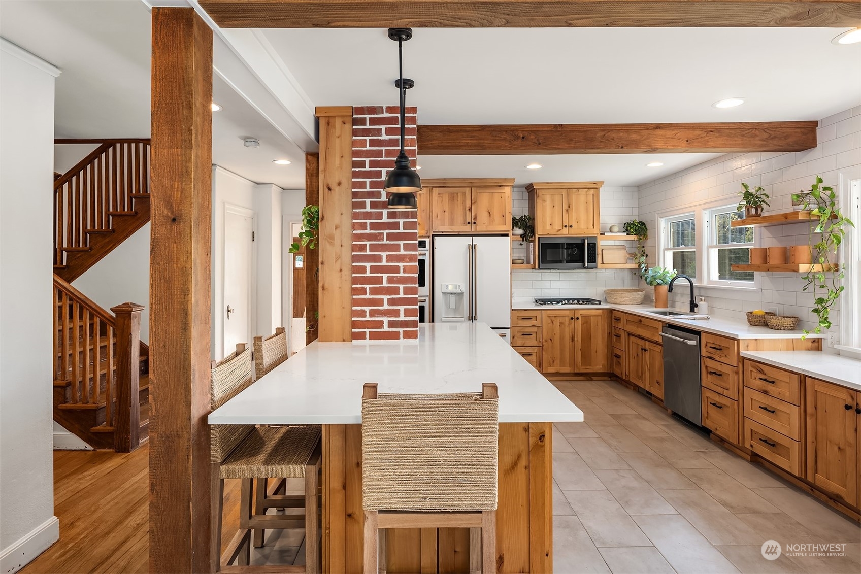 7715 Robe Menzel Road Granite Falls, WA 98252 - Photo 13 of 38 a kitchen with stainless steel appliances kitchen island granite countertop a sink and cabinets