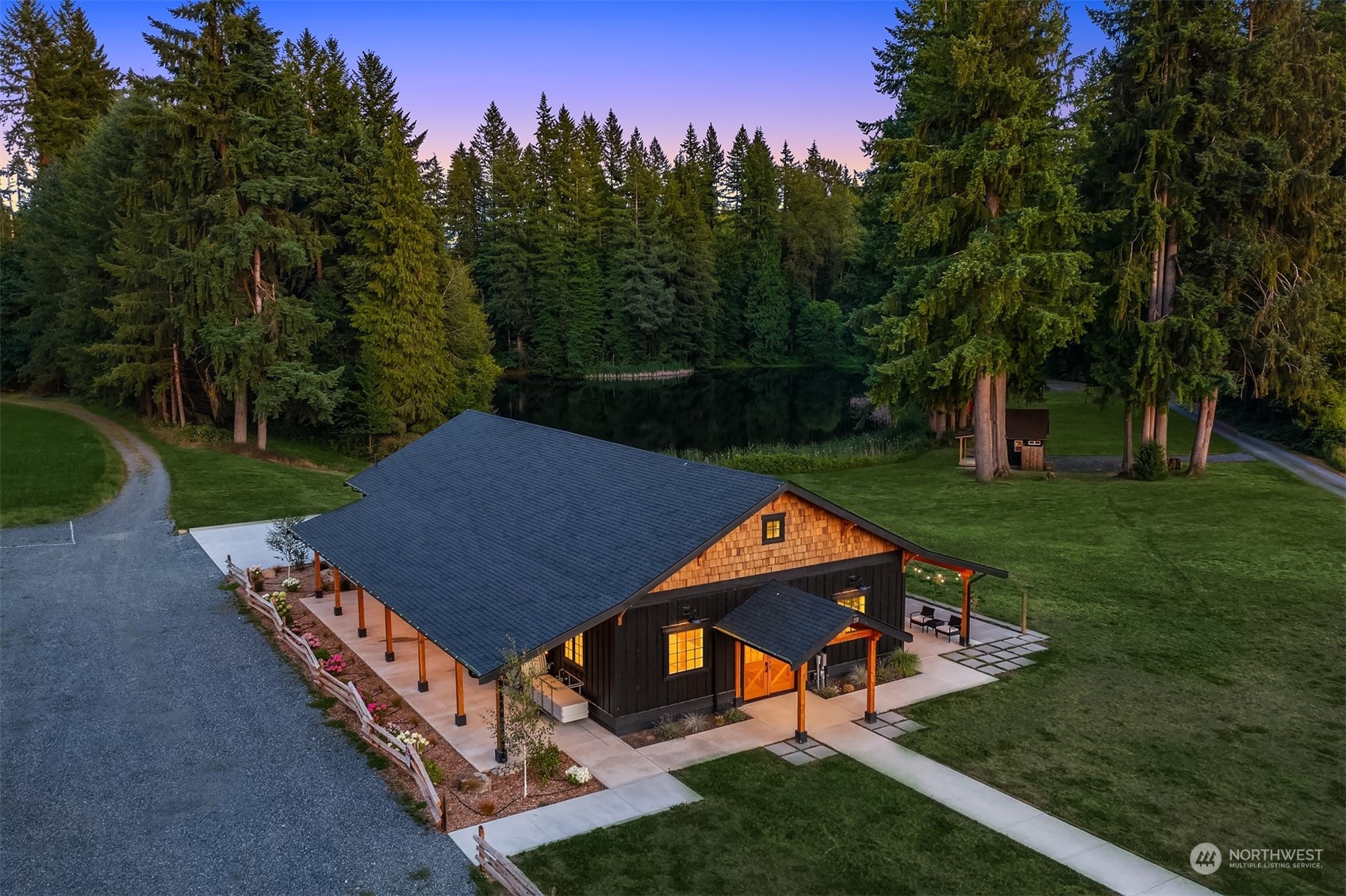 7715 Robe Menzel Road Granite Falls, WA 98252 - Photo 19 of 38 a aerial view of a house with a yard table and chairs