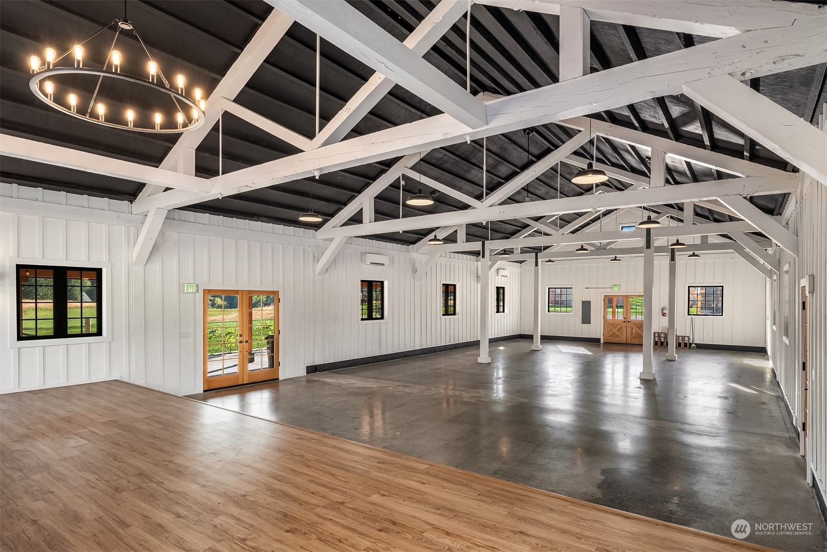 7715 Robe Menzel Road Granite Falls, WA 98252 - Photo 24 of 38 a view of an empty room with chandelier fan and wooden floor