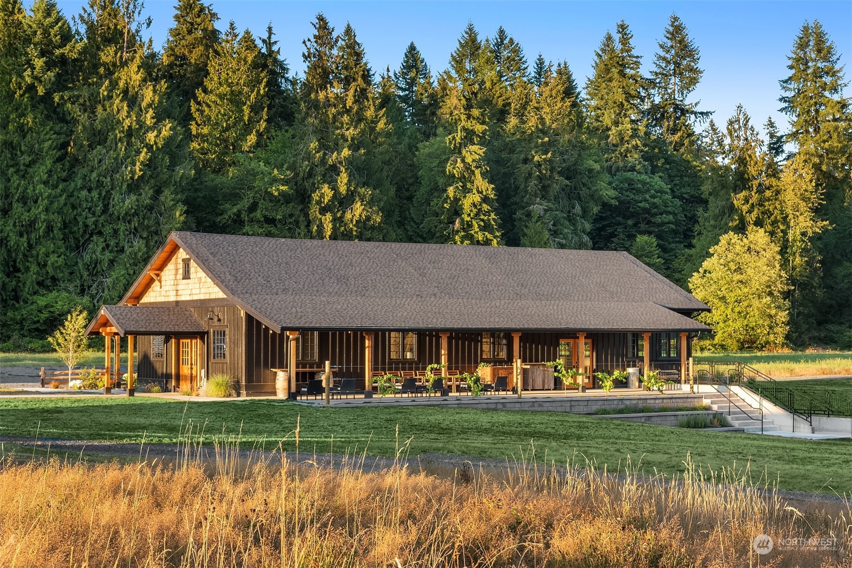 7715 Robe Menzel Road Granite Falls, WA 98252 - Photo 25 of 38 a front view of a house with a yard table and chairs