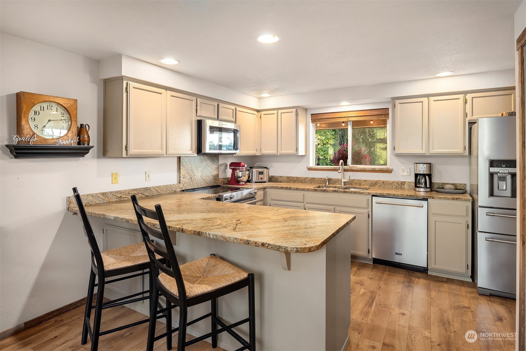 7715 Robe Menzel Road Granite Falls, WA 98252 - Photo 27 of 38 a kitchen with sink cabinets and dining table