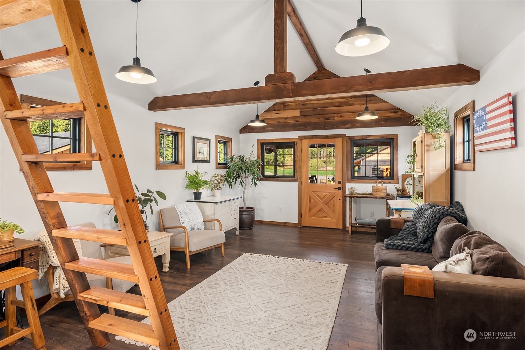 7715 Robe Menzel Road Granite Falls, WA 98252 - Photo 30 of 38 a living room with furniture a wooden floor and next to a large window