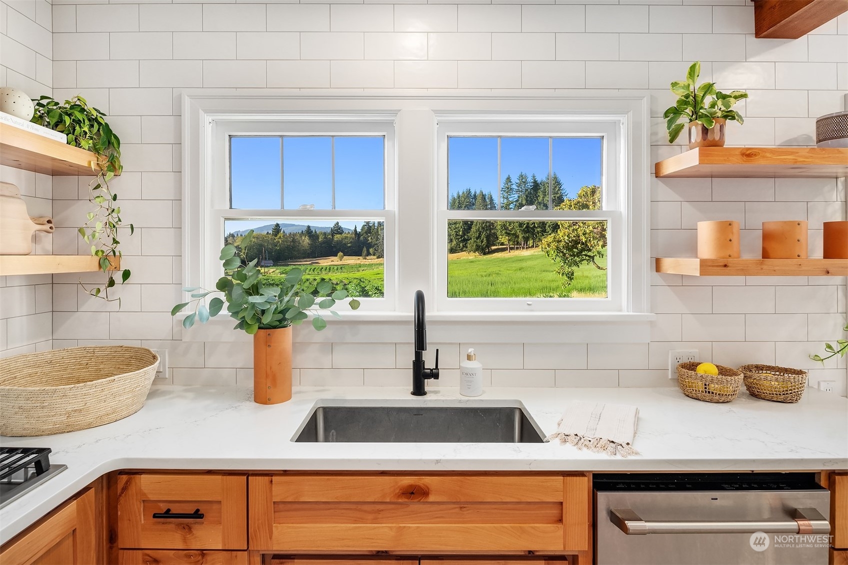 7715 Robe Menzel Road Granite Falls, WA 98252 - Photo 10 of 38 a kitchen with a granite countertop sink and potted plant