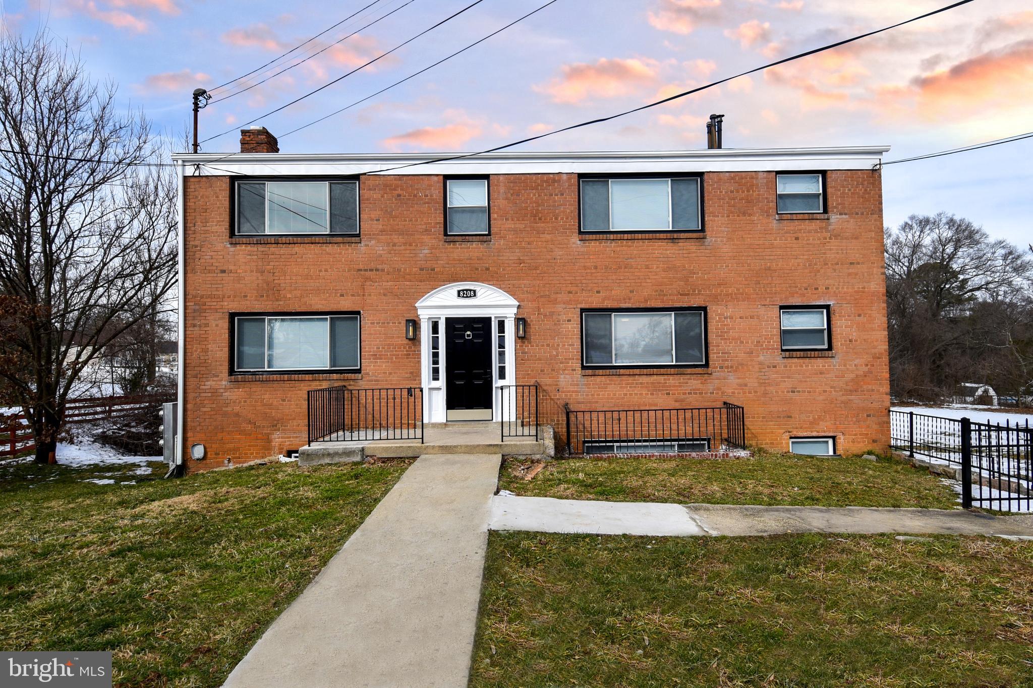 8208 Bellefonte Lane, Unit 2 Clinton, MD 20735 - Photo 1 of 38 a front view of a house with a yard