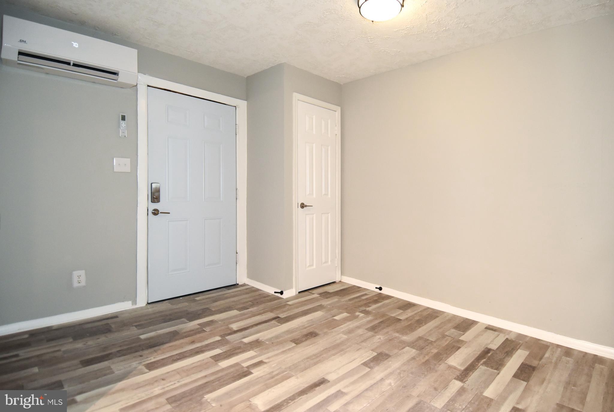 8208 Bellefonte Lane, Unit 2 Clinton, MD 20735 - Photo 35 of 38 a view of a room with wooden floor