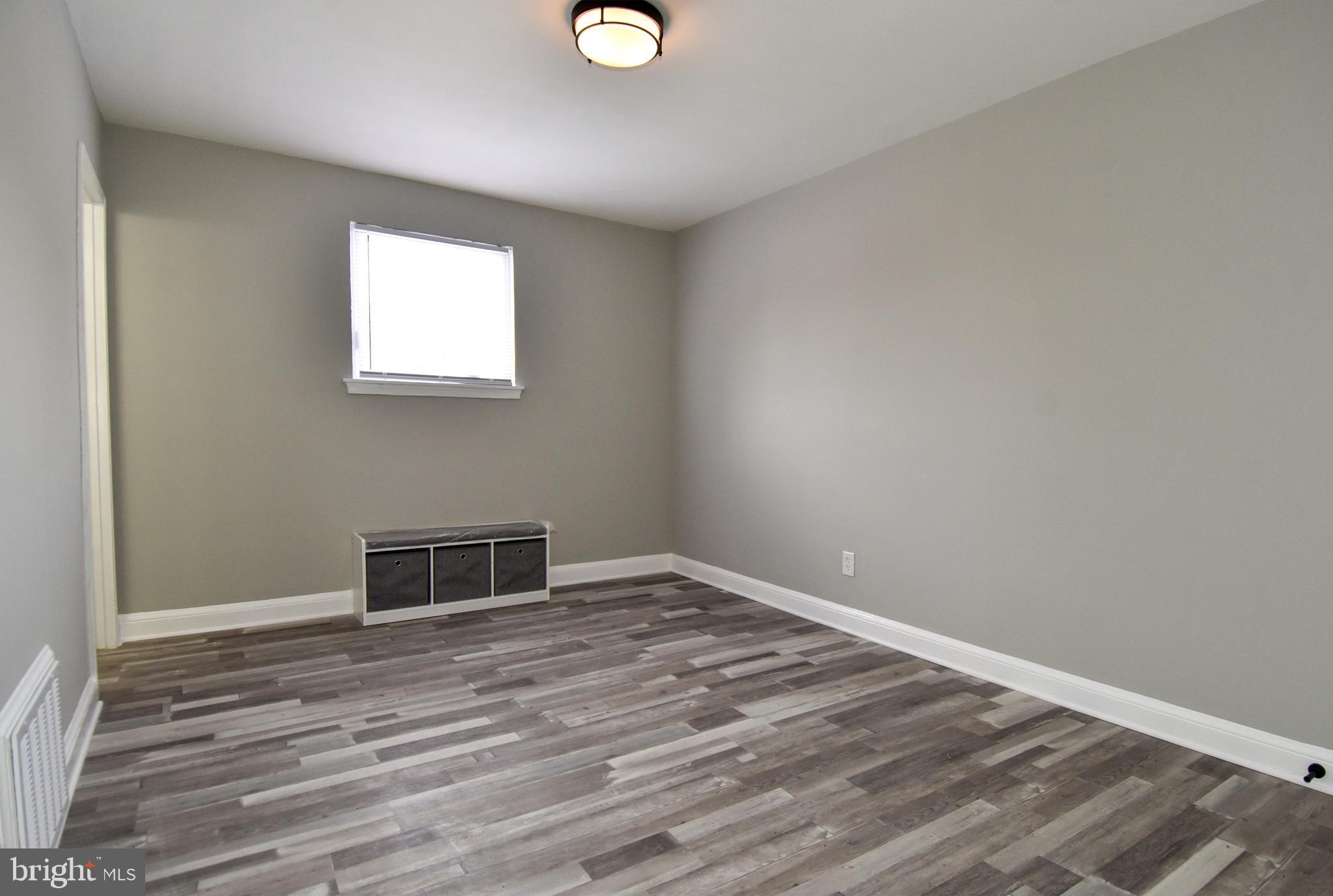8208 Bellefonte Lane, Unit 2 Clinton, MD 20735 - Photo 8 of 38 a view of empty room with wooden floor