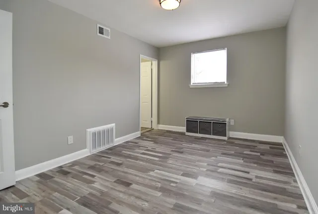 a view of a livingroom with wooden floor