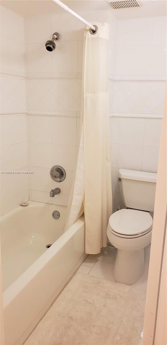 370 Racquet Club Road, Unit 103 Weston, FL 33326 - Photo 12 of 16 a bathroom with a toilet and a bathtub