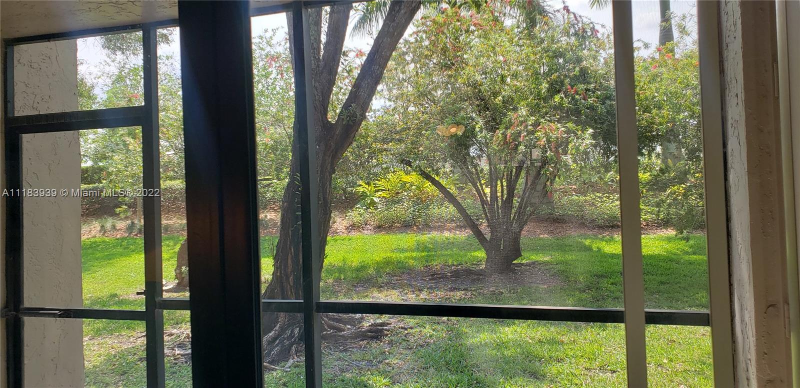 370 Racquet Club Road, Unit 103 Weston, FL 33326 - Photo 15 of 16 a view of a garden from a window