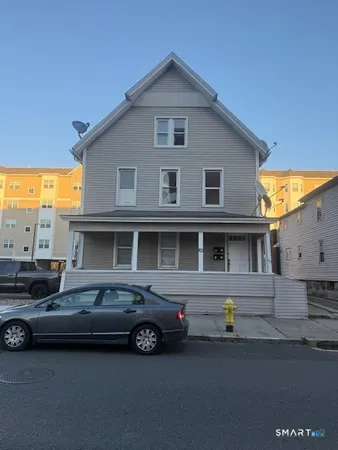 a car parked in front of a house