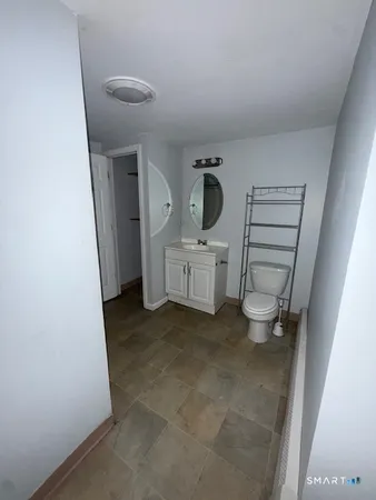 a view of an empty room and wooden floor
