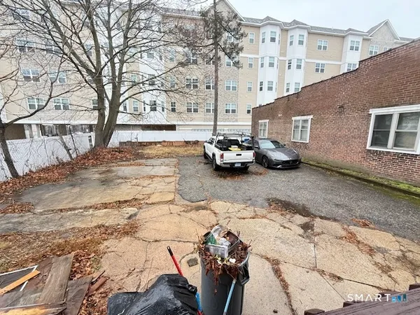 a view of street with parked cars