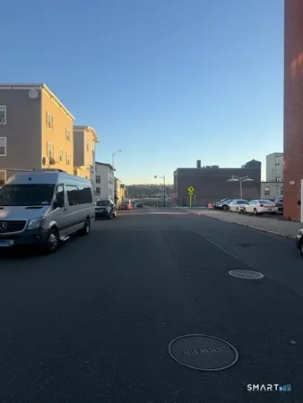 a view of a city street with cars