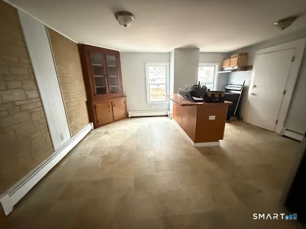 a view of a kitchen with furniture and a window