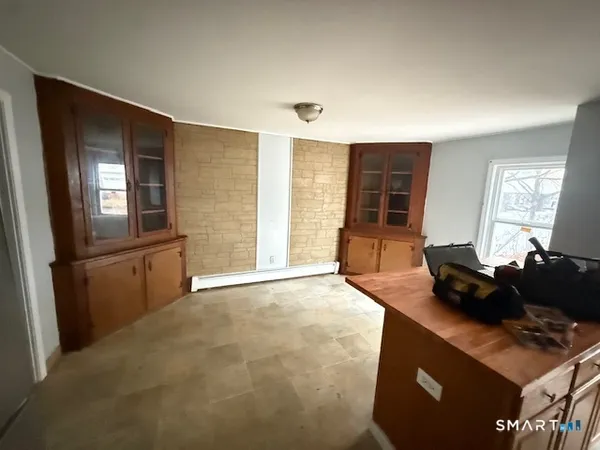 a kitchen with granite countertop a stove and a refrigerator