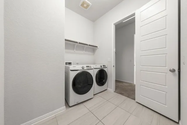 a utility room with dryer and washer