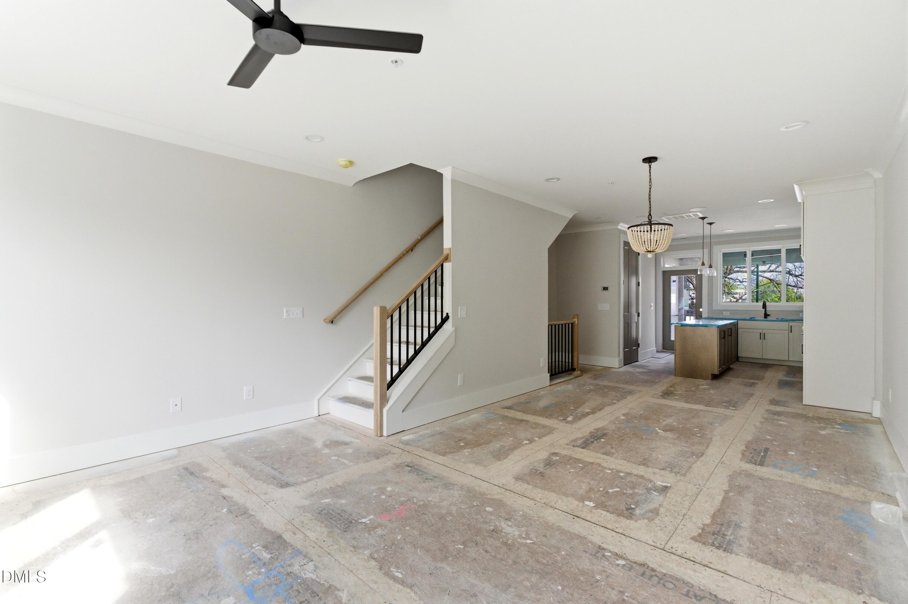 720 Noble Town Way, Unit 104 Raleigh, NC 27603 - Photo 8 of 21 The second story features all of your main living areas including a gourmet kitchen, spacious living areas, dining room, powder room, complete with built-in bluetooth speakers in the ceilings and a second story screened-in porch
