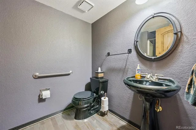 a bedroom with a bed a dresser and chair