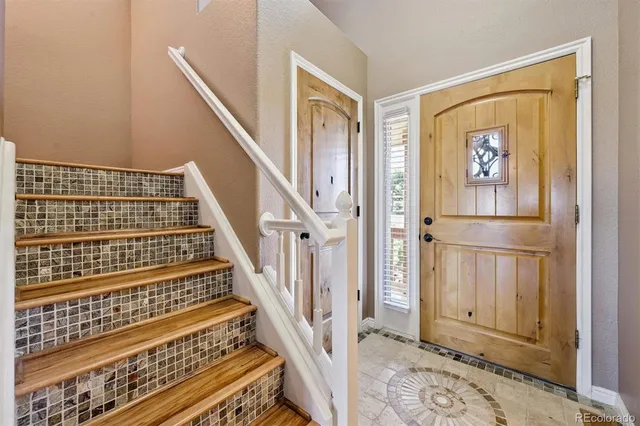 a view of an entryway with staircase