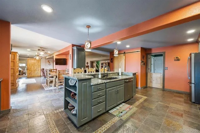 a view of a dining room with furniture wooden floor and chandelier