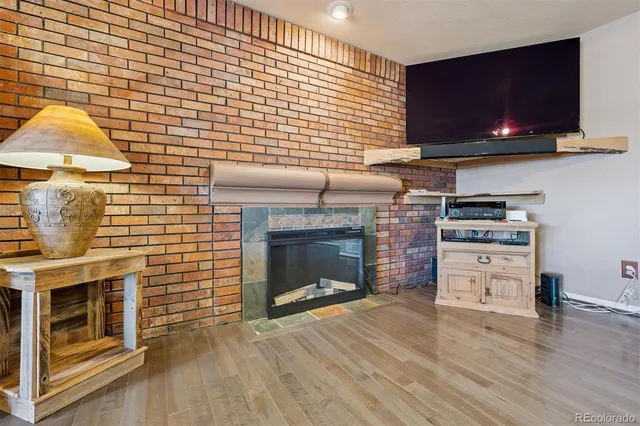 a view of a livingroom with furniture and a fireplace