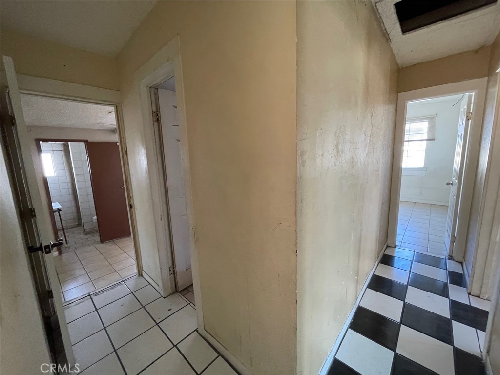 845 North Hagar Street San Fernando, CA 91340 - Photo 13 of 28 a view of a closet from a corridor