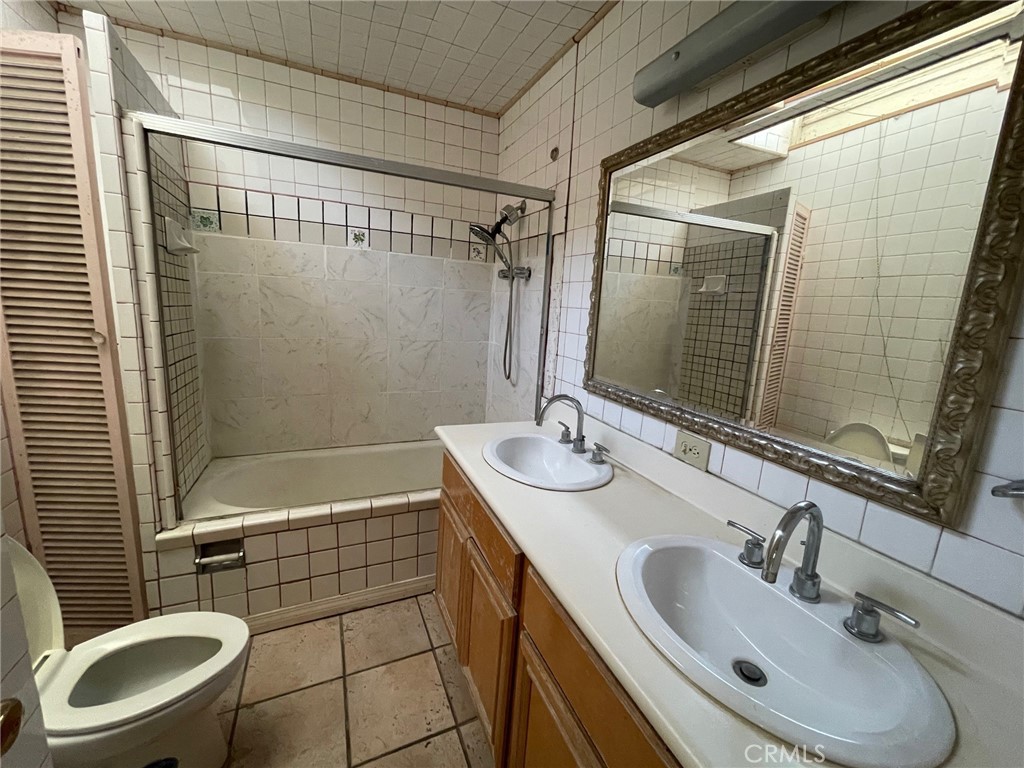 845 North Hagar Street San Fernando, CA 91340 - Photo 17 of 28 a bathroom with a sink toilet and shower
