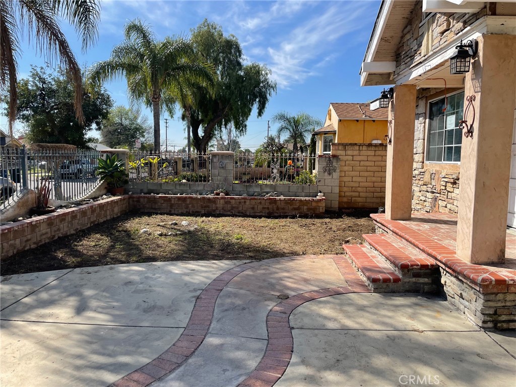 845 North Hagar Street San Fernando, CA 91340 - Photo 2 of 28 a view of a backyard with palm trees