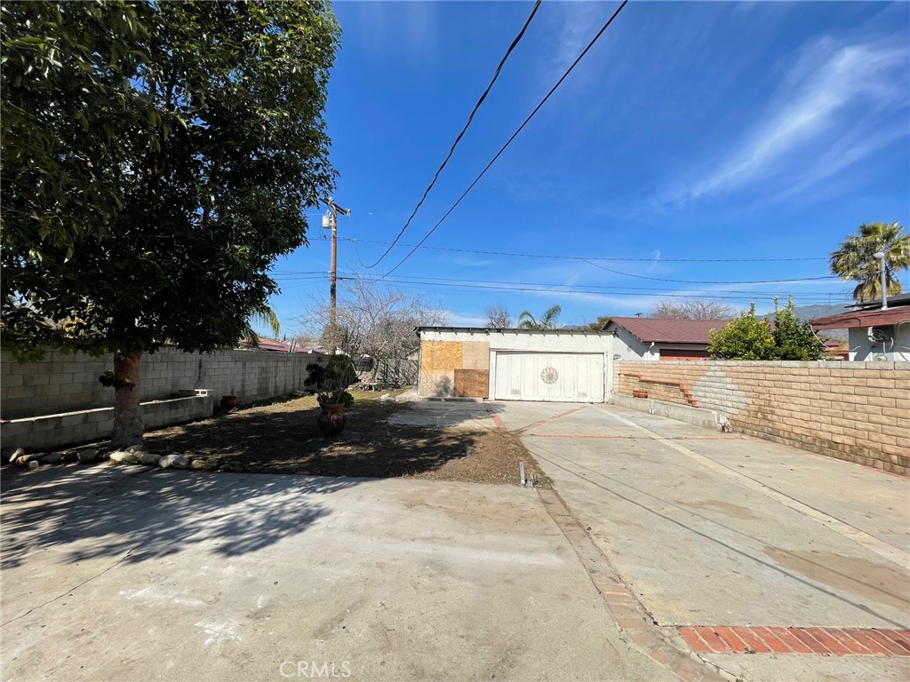845 North Hagar Street San Fernando, CA 91340 - Photo 5 of 28 a view of a street with a house in the background