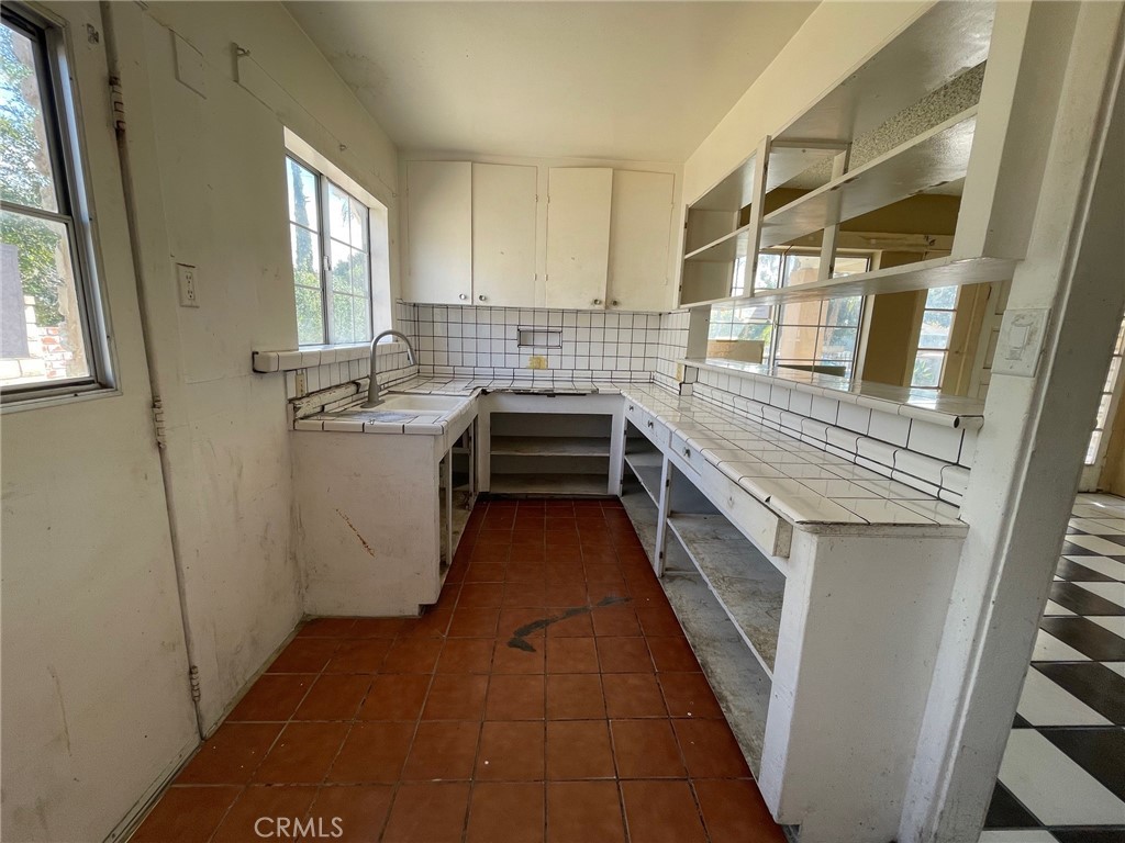 845 North Hagar Street San Fernando, CA 91340 - Photo 9 of 28 a kitchen with a sink and cabinets
