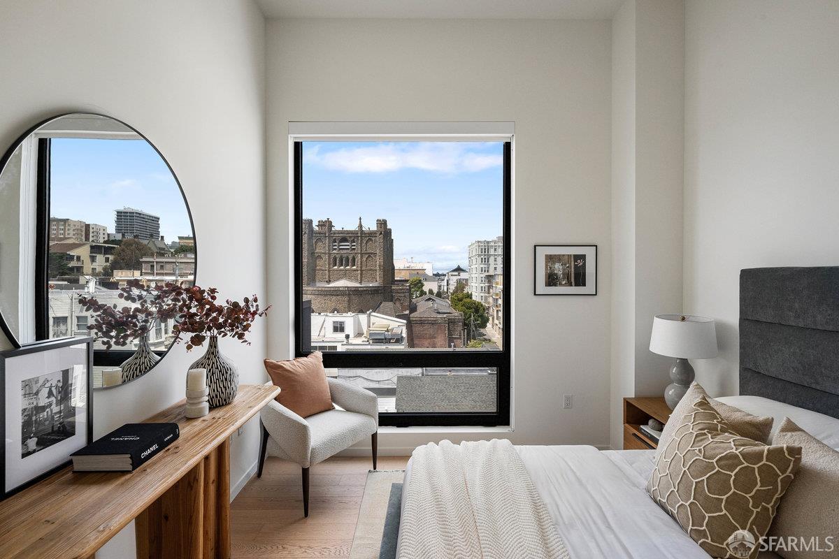 1523 Franklin Street, Unit PH8 San Francisco, CA 94109 - Photo 6 of 10 a bedroom with a bed and a large window