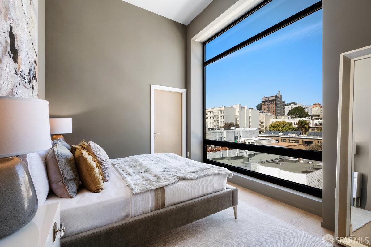 1523 Franklin Street, Unit PH8 San Francisco, CA 94109 - Photo 7 of 10 a bedroom with a bed and window