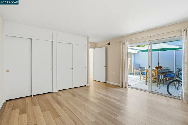 a view of a livingroom with furniture and bicycles