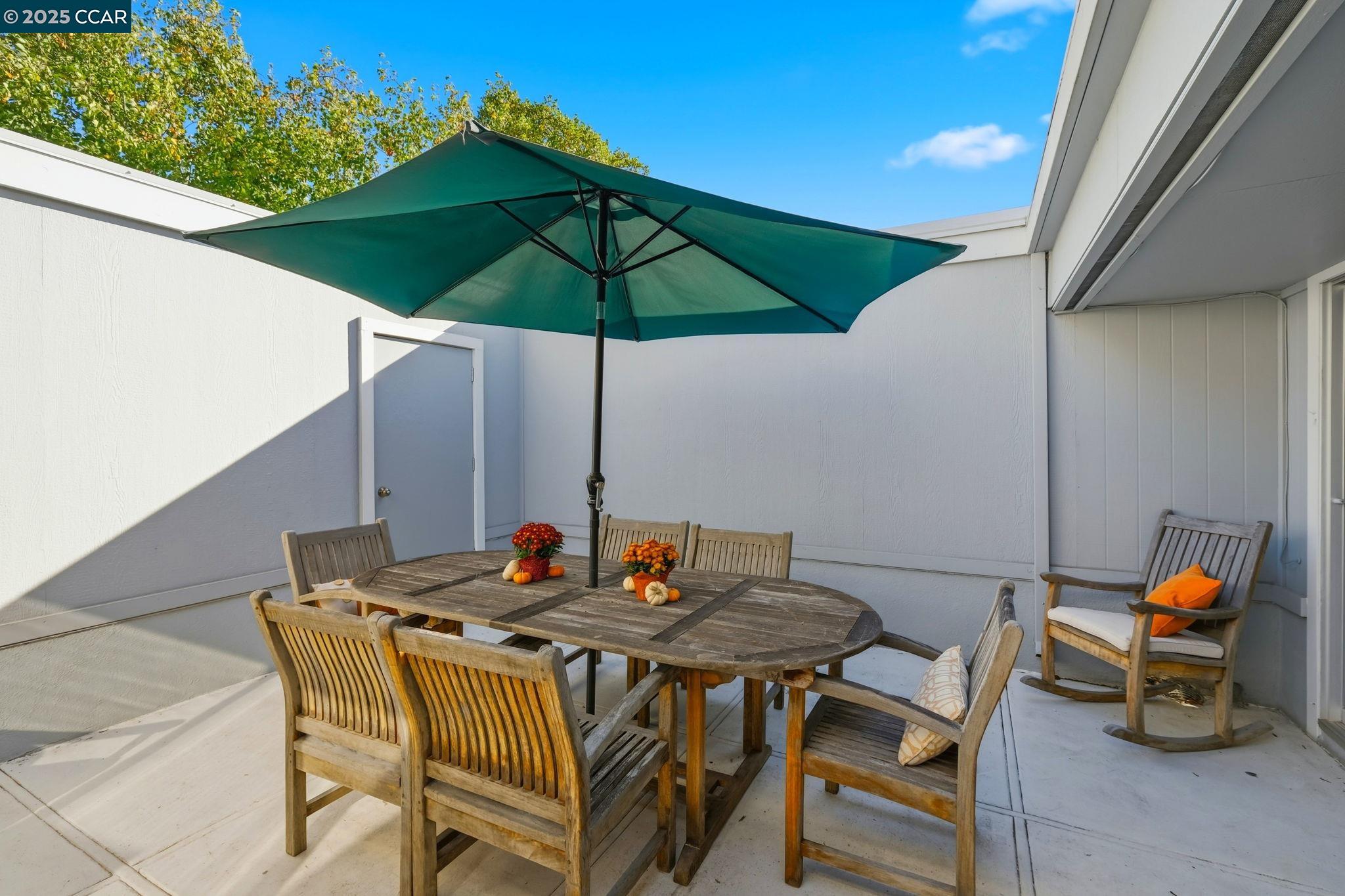 2425 Pine Knoll Drive, Unit 1 Walnut Creek, CA 94595 - Photo 21 of 43 a table and chairs in the patio
