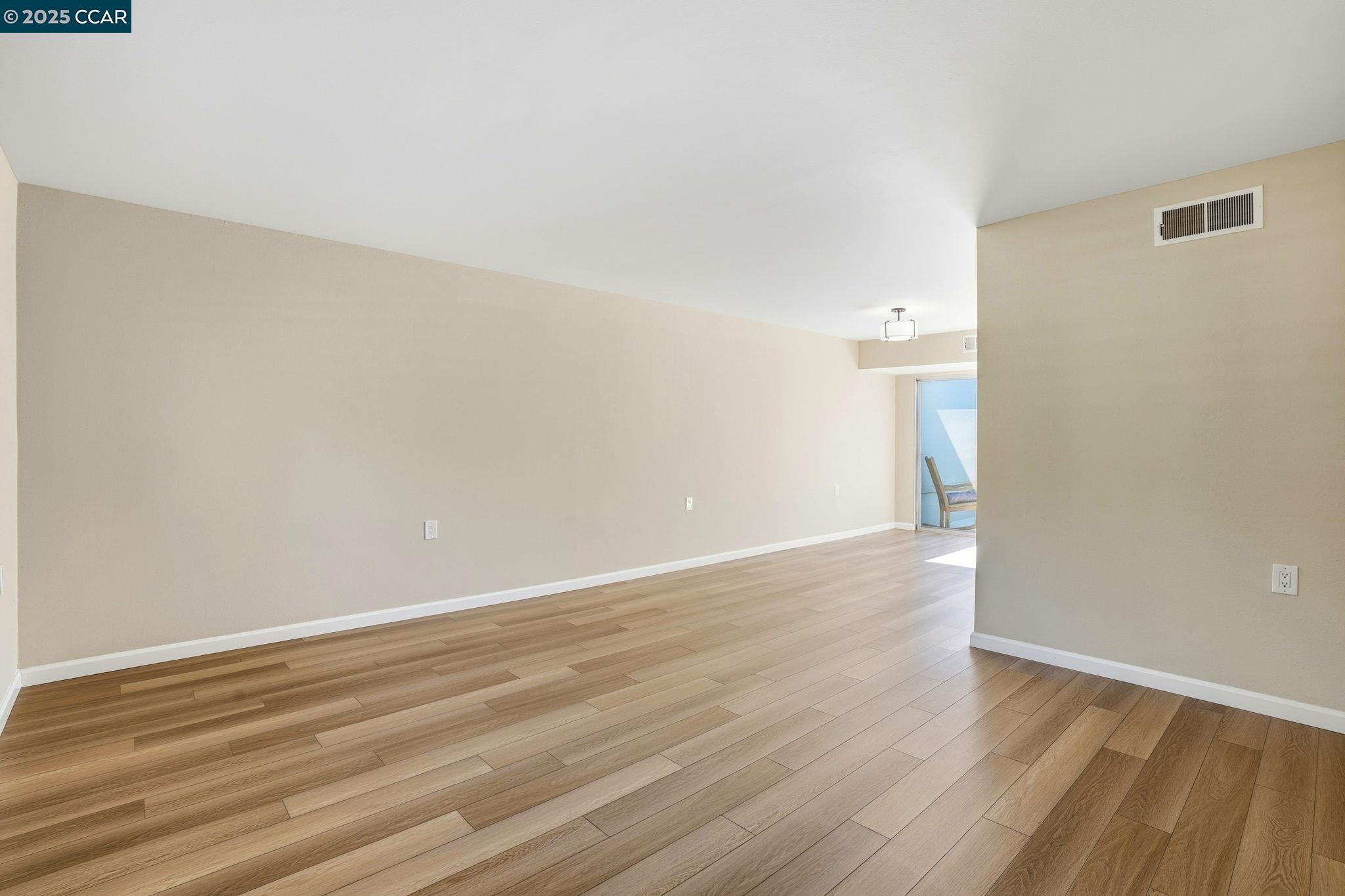 2425 Pine Knoll Drive, Unit 1 Walnut Creek, CA 94595 - Photo 4 of 43 a view of an empty room with wooden floor