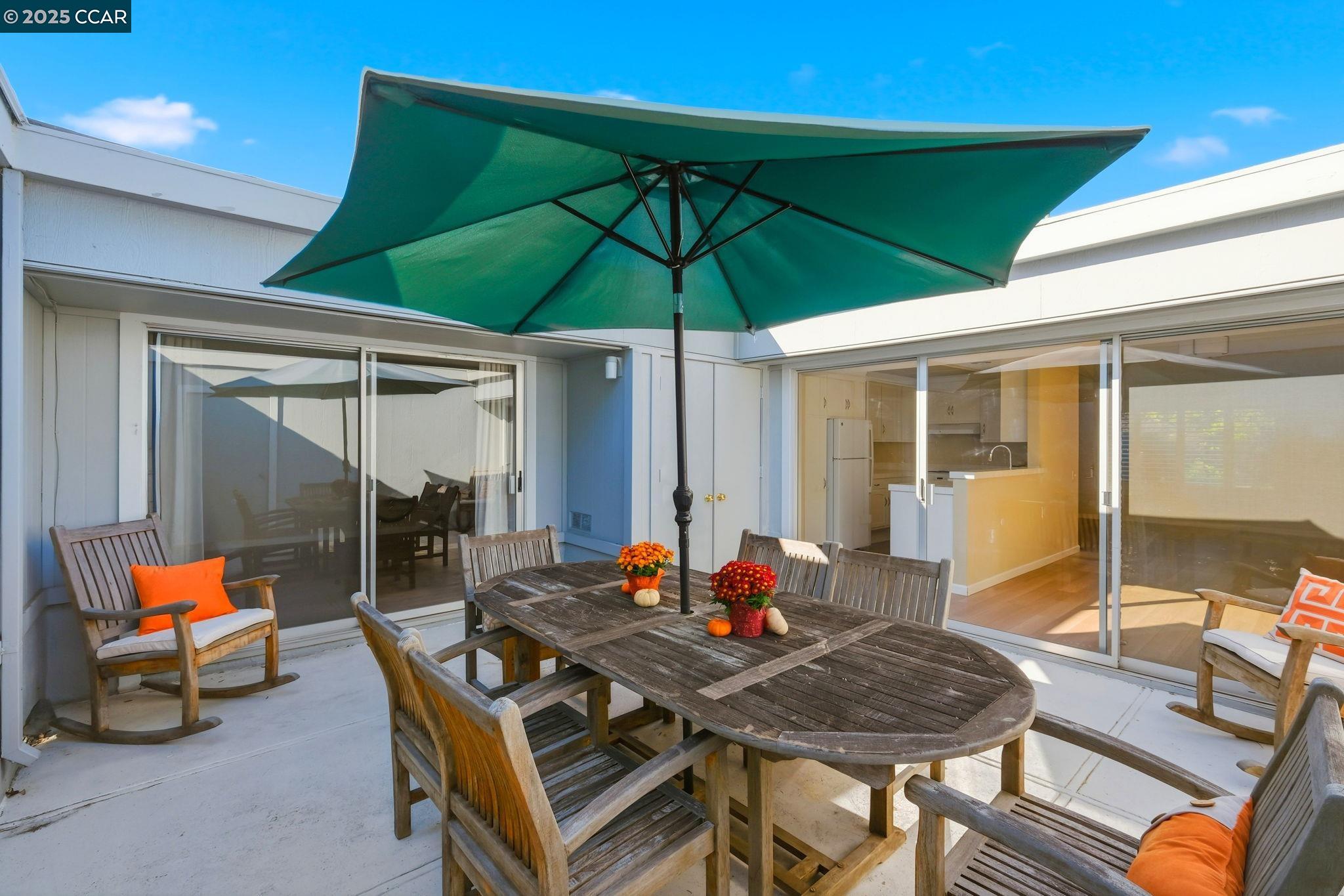 2425 Pine Knoll Drive, Unit 1 Walnut Creek, CA 94595 - Photo 10 of 43 a table and chairs in the patio