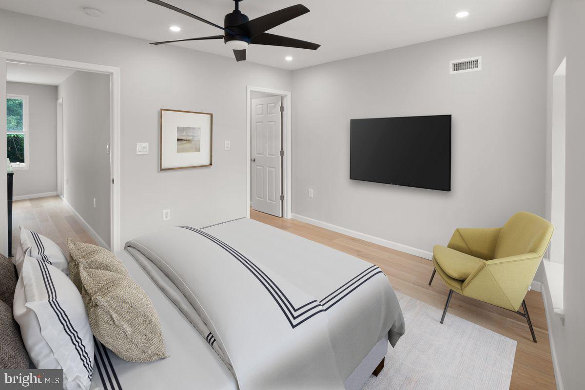 4129 Terrace Street Philadelphia, PA 19128 - Photo 13 of 27 a bedroom with a bed and a flat screen tv