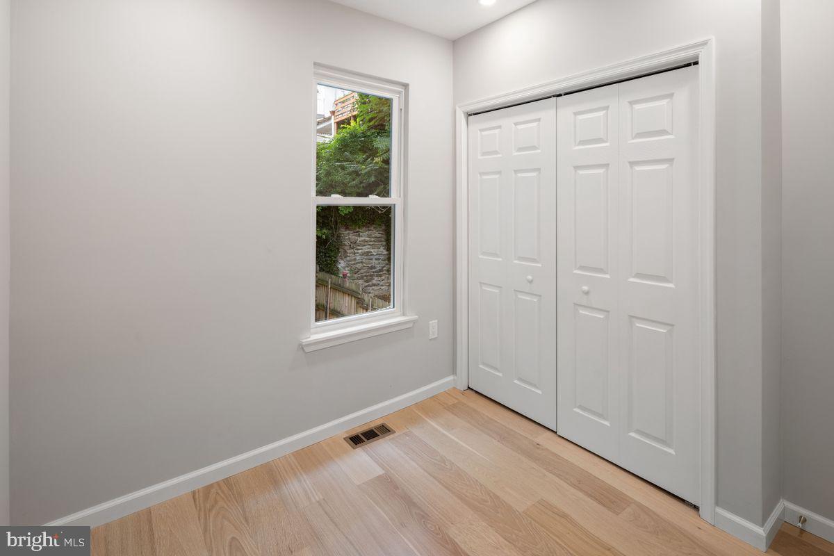 4129 Terrace Street Philadelphia, PA 19128 - Photo 18 of 27 an empty room with windows and closet
