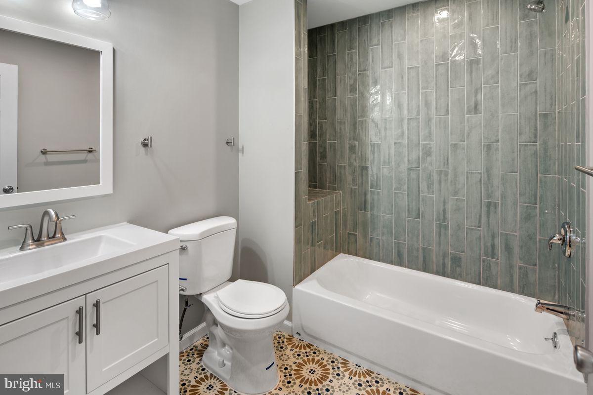 4129 Terrace Street Philadelphia, PA 19128 - Photo 21 of 27 a bathroom with a sink a toilet and shower