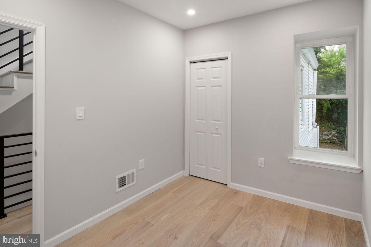 4129 Terrace Street Philadelphia, PA 19128 - Photo 24 of 27 an empty room with windows and closet