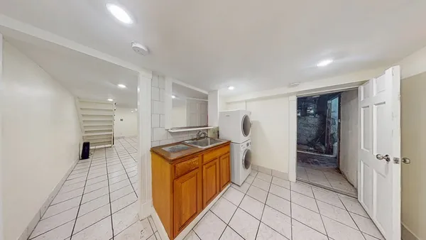 a bathroom with a toilet sink and shower