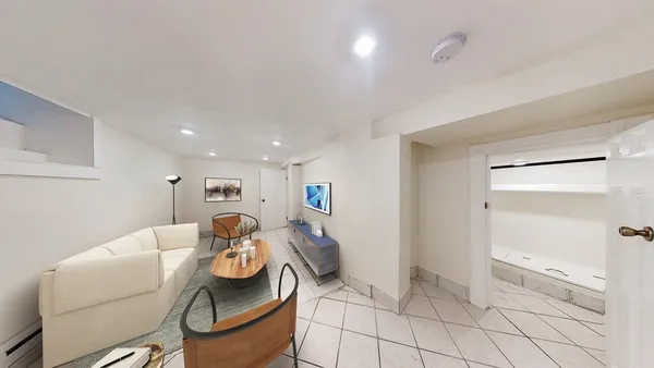 a living room with furniture and a rug