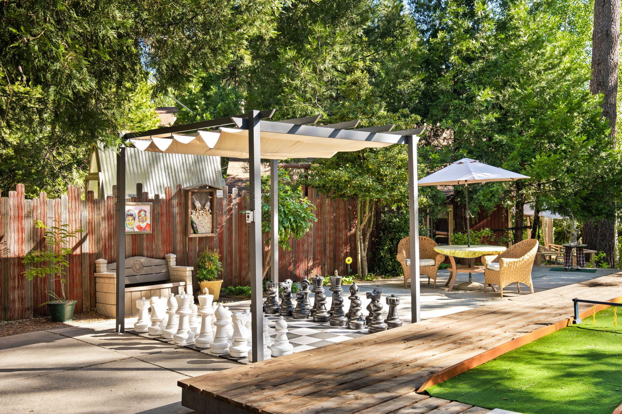25210 Fern Valley Road Idyllwild, CA 92549 - Photo 101 of 127 a patio with a yard table and chairs