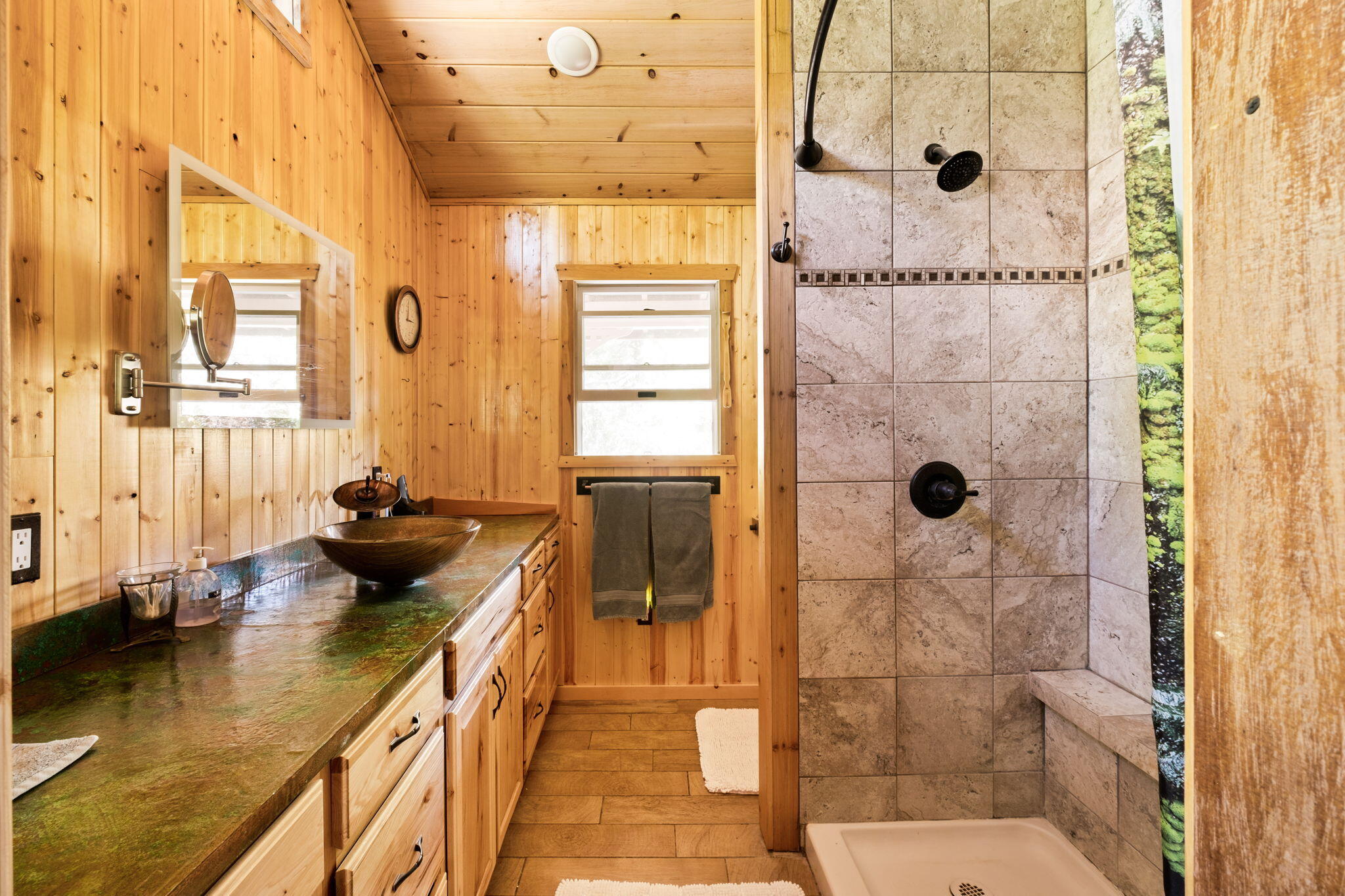 25210 Fern Valley Road Idyllwild, CA 92549 - Photo 28 of 127 a bathroom with a granite countertop shower a mirror and a sink