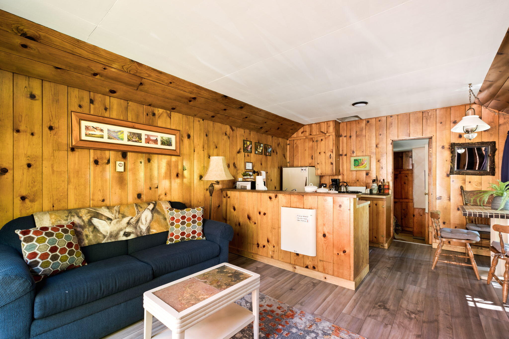 25210 Fern Valley Road Idyllwild, CA 92549 - Photo 32 of 127 a living room with furniture and wooden floor