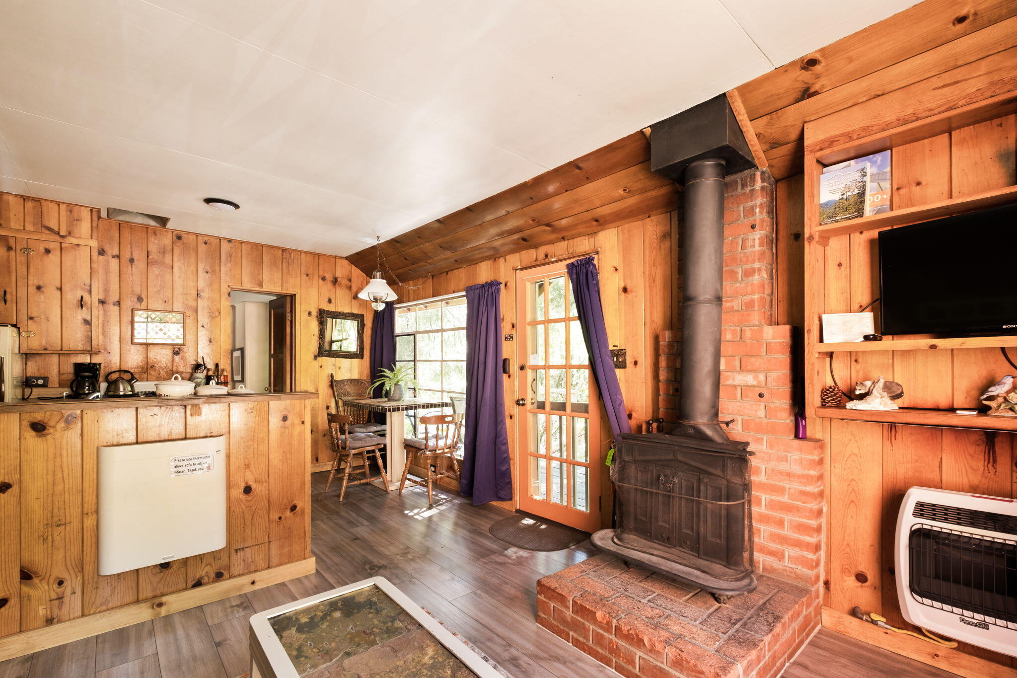 25210 Fern Valley Road Idyllwild, CA 92549 - Photo 33 of 127 a view of living room with furniture and flat screen tv