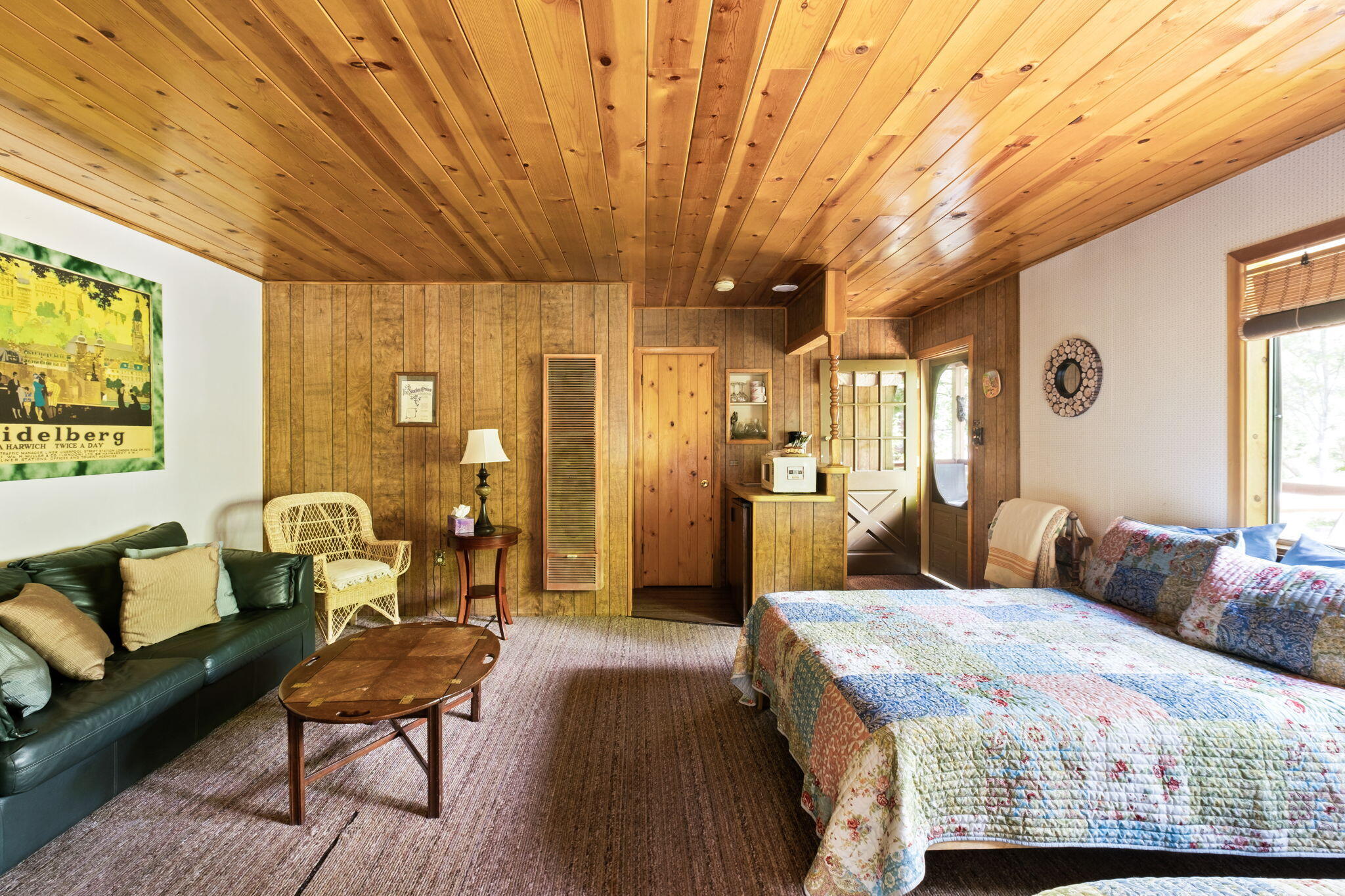 25210 Fern Valley Road Idyllwild, CA 92549 - Photo 60 of 127 a bedroom with a bed and wooden floor