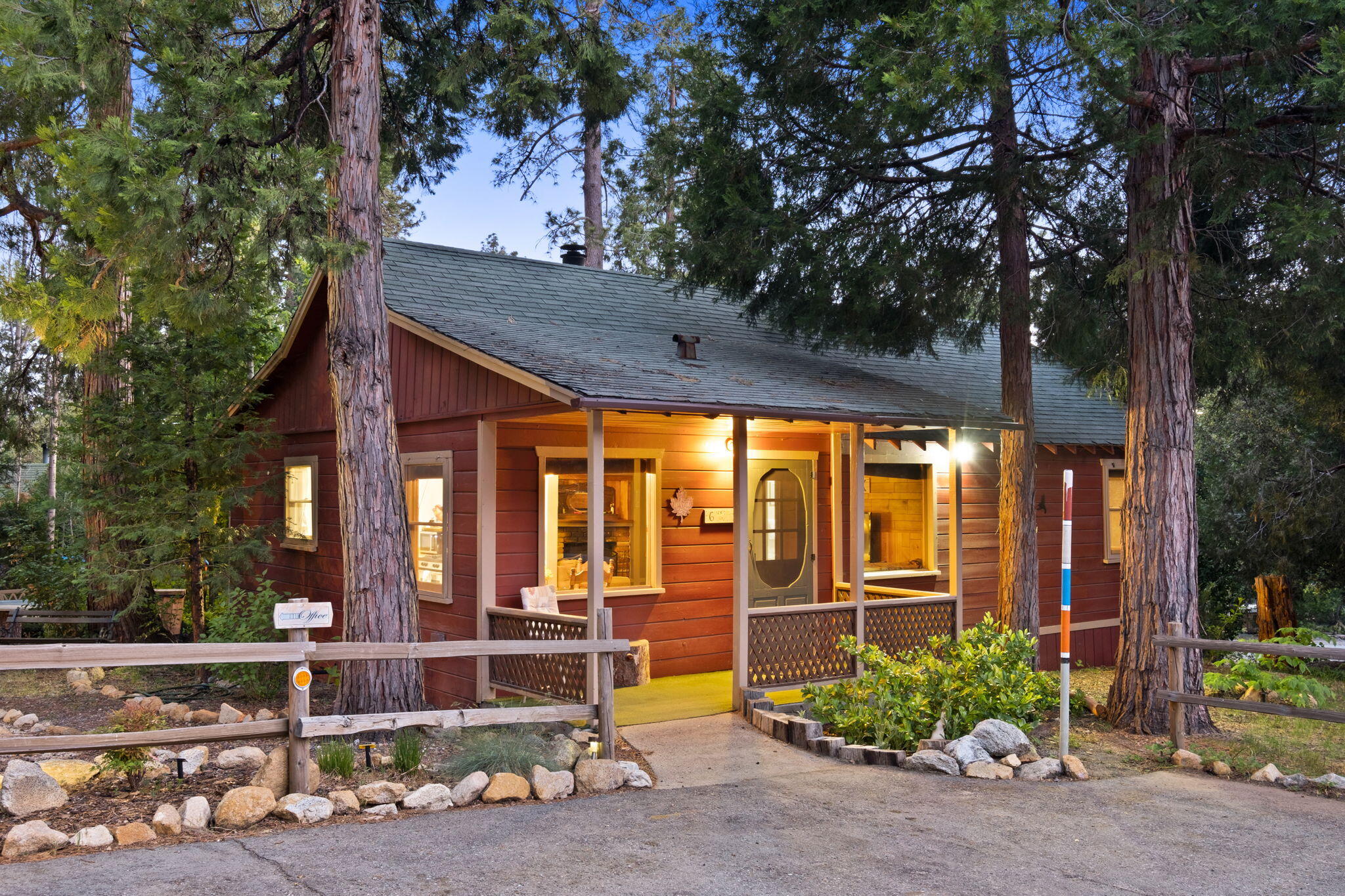 25210 Fern Valley Road Idyllwild, CA 92549 - Photo 7 of 127 a view of a house with large windows and a large tree