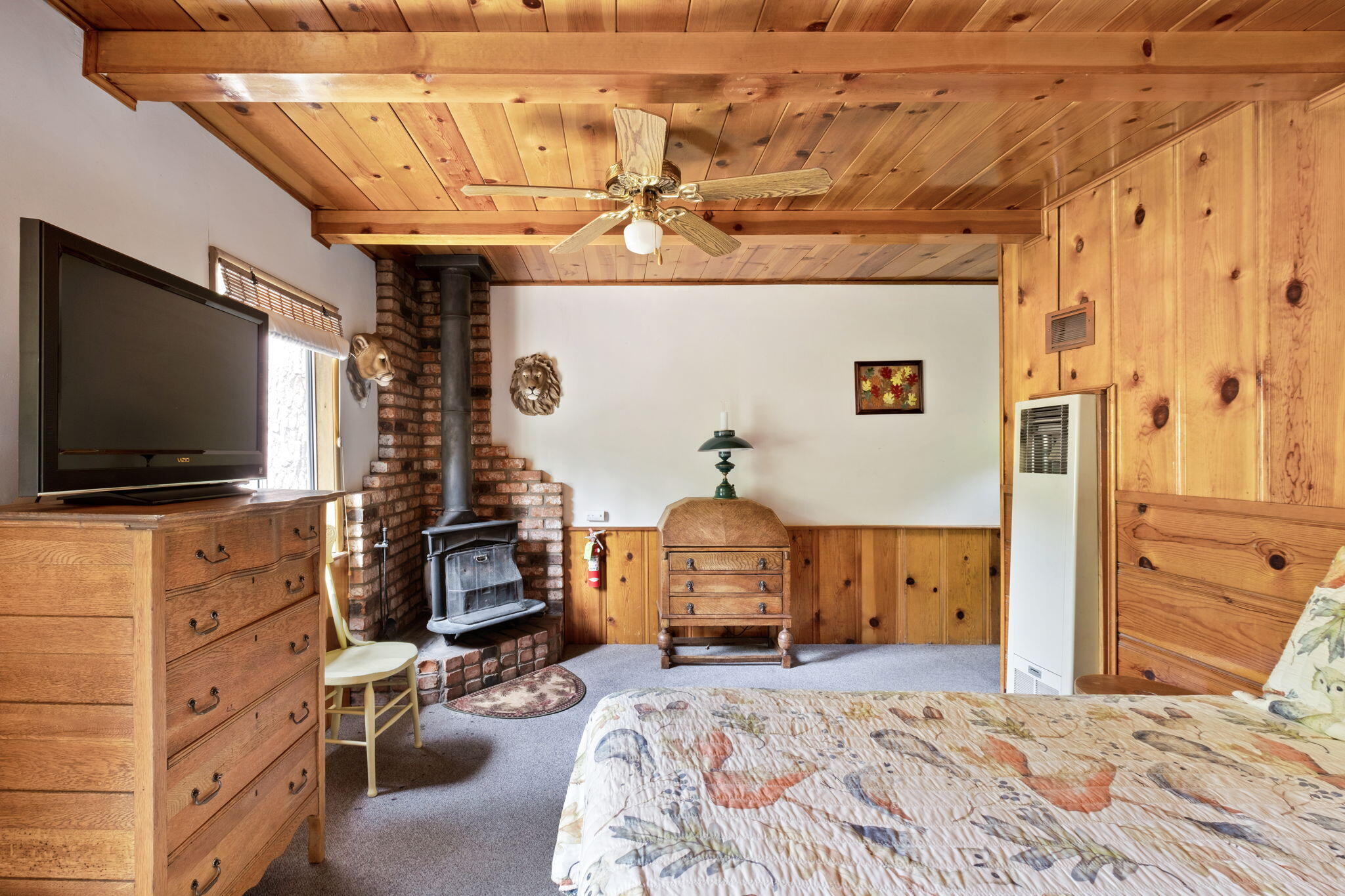25210 Fern Valley Road Idyllwild, CA 92549 - Photo 71 of 127 a bedroom with a bed and flat tv screen